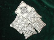 pincushions decorated with blackwork