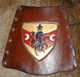 a bracer with heraldic decoration
